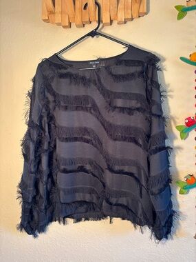 Athena Marie long-sleeve blouse features distinctive fringe